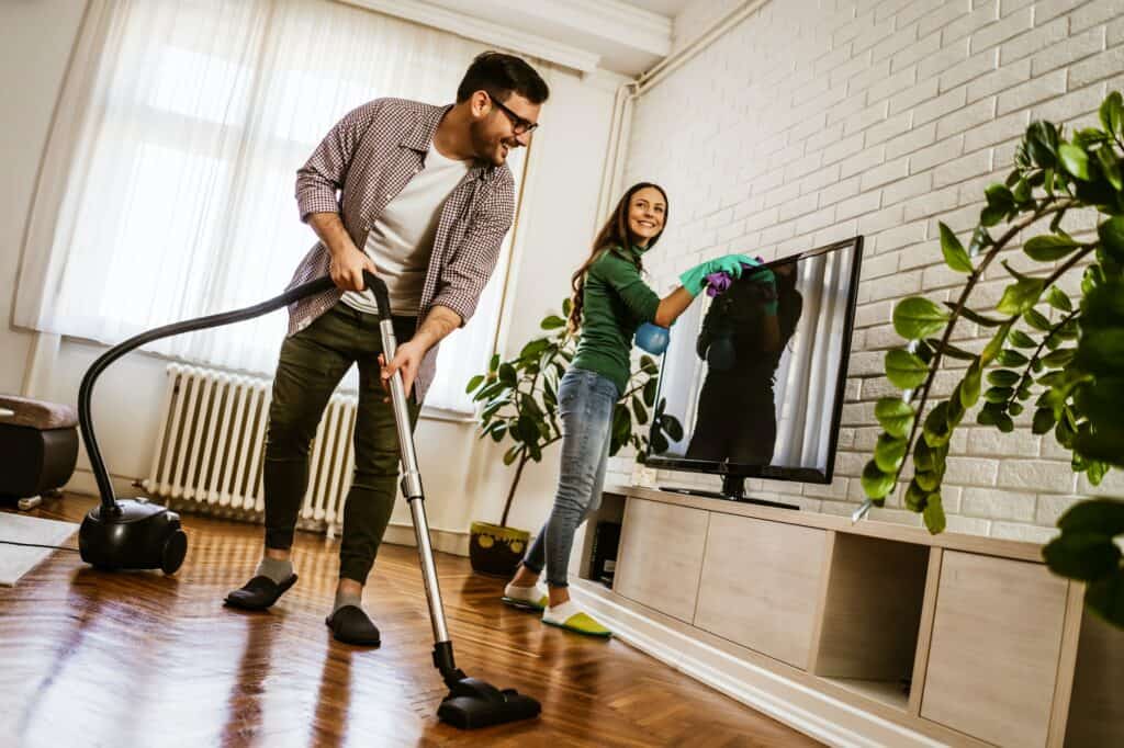 Couple cleaning their home