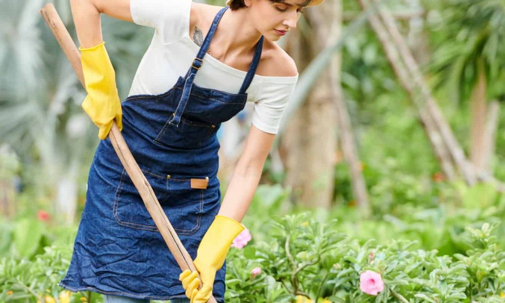 Woman working in flower garden